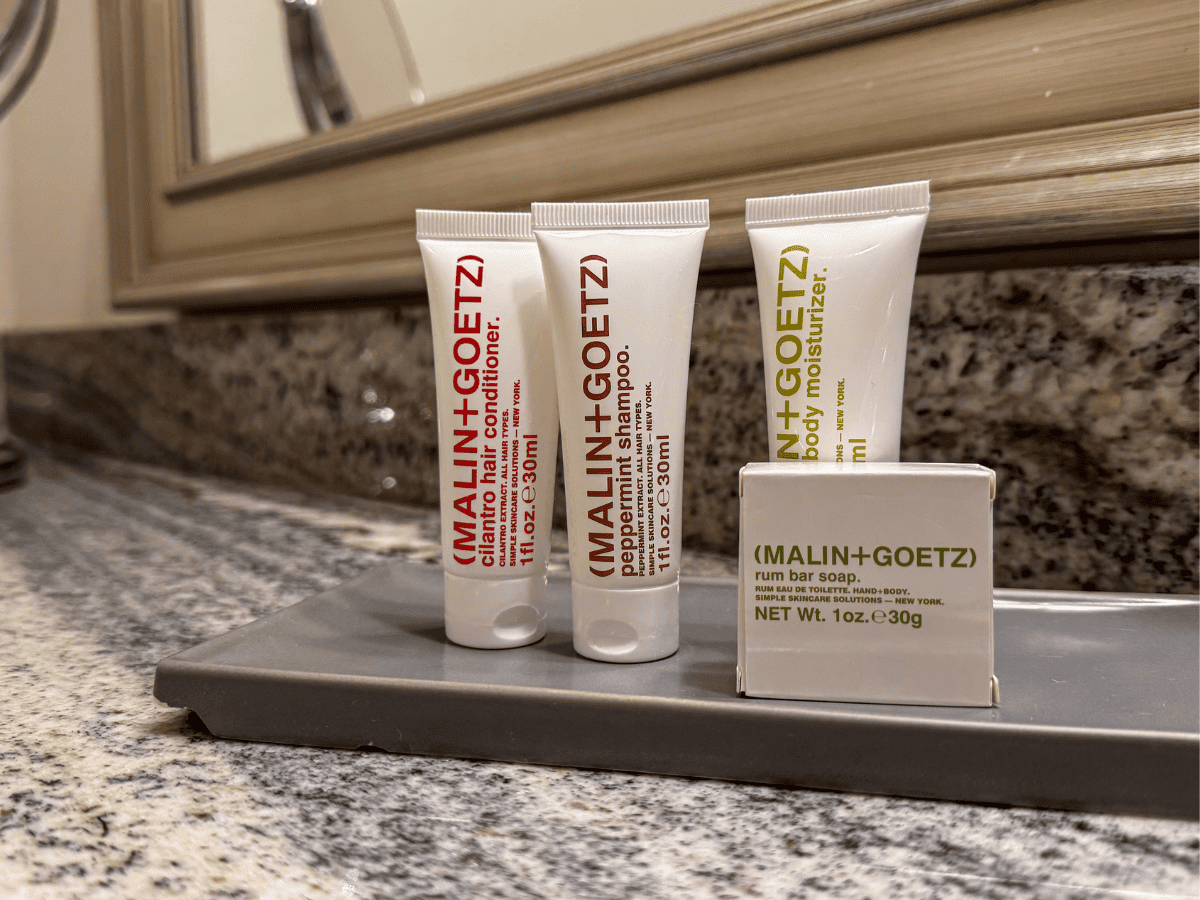 Fancy Malin + Goetz shampoo and conditioner inside bathroom of Hotel Boulderado