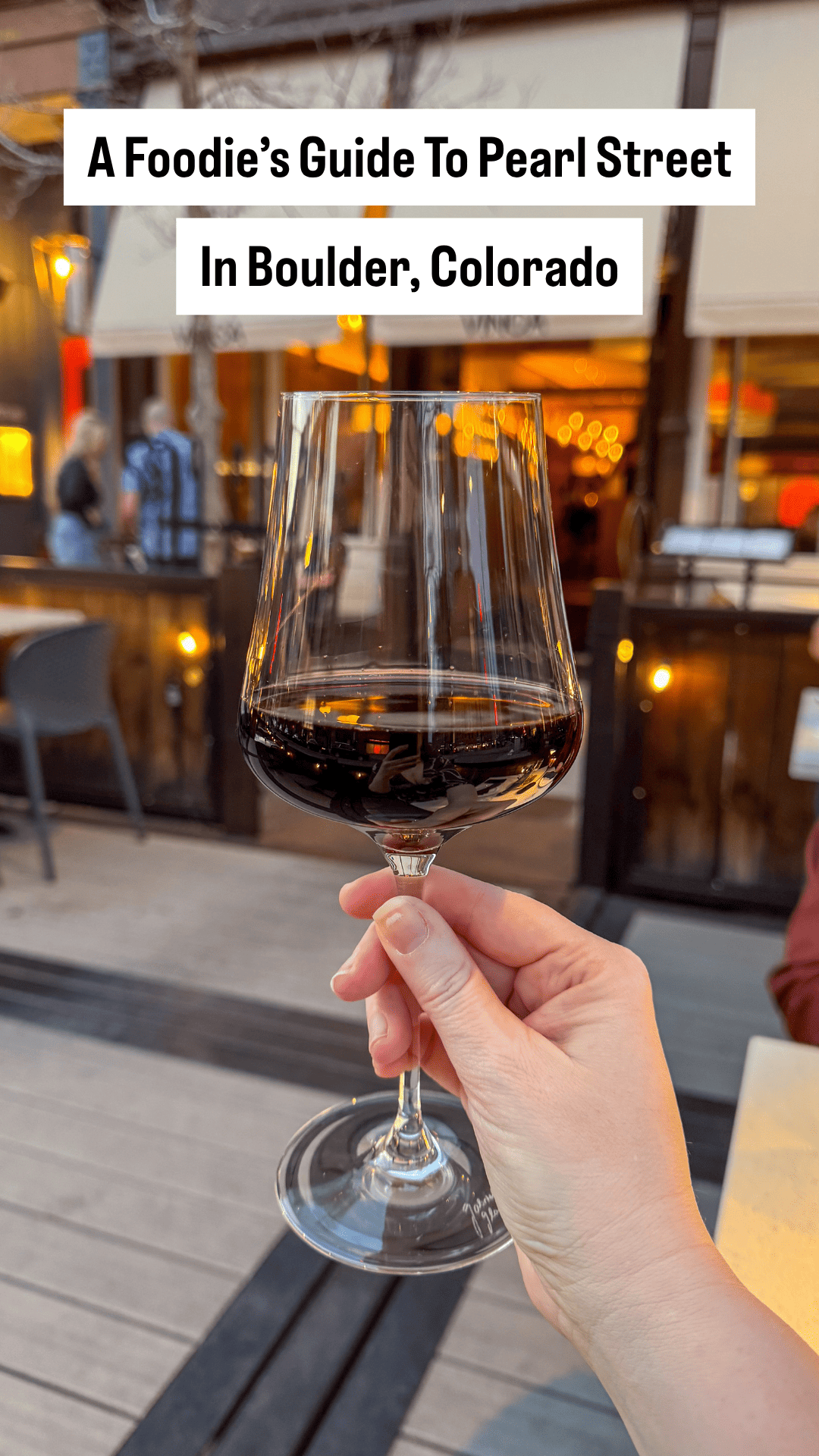 Holding Up a glass of wine in Boulder, Colorado