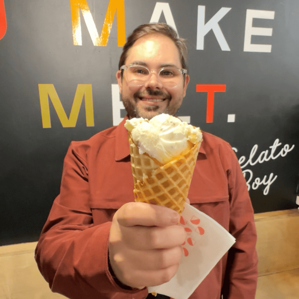 Joey holding up a generous scoop of Key Lime Pie Cheesecake Ice Cream from Gelato Boy