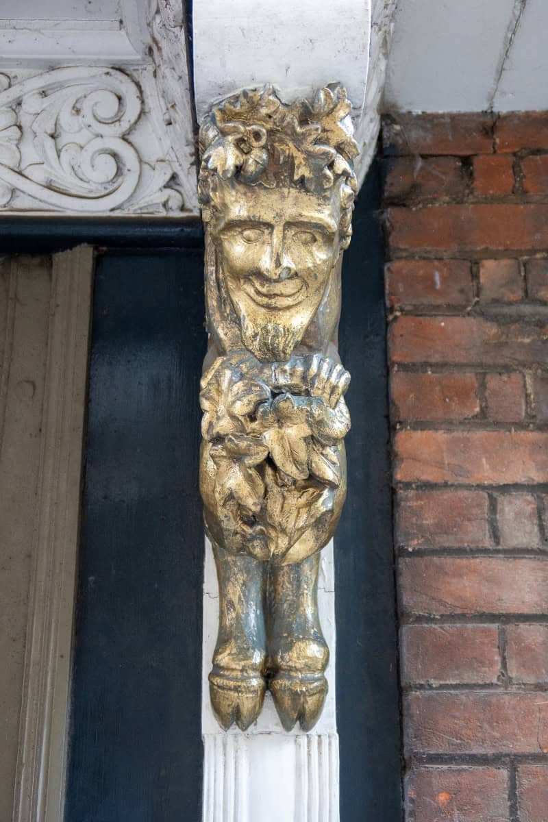 Carved satyr detail on the Narnia door St Mary's Passage Oxford