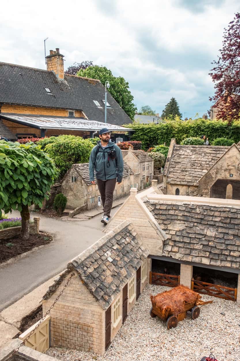 Man walking through the Model Village walking the Cotswolds in Bourton-on-the-Water