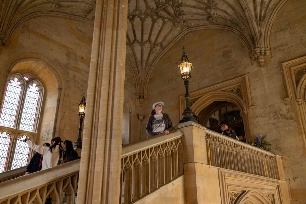 Katie standing on the Hall Stairs at Christ Church College Oxford