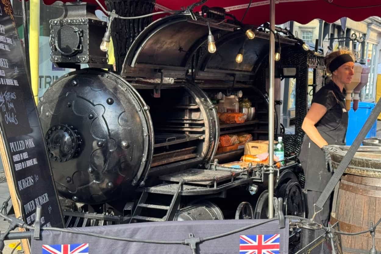 BBQ food stall shaped like a train at a street festival in Bath, England