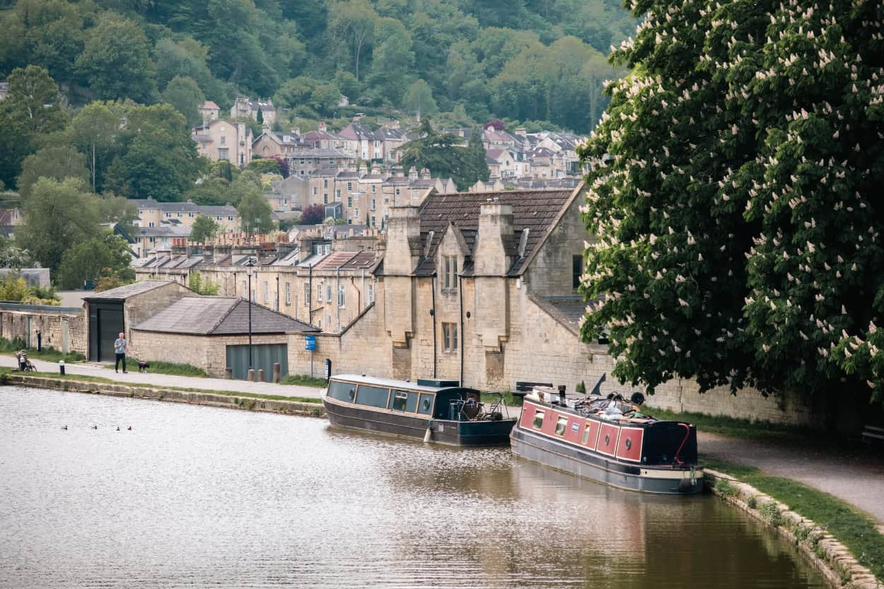 Canal boats on the River Avon in Bath, England, a scenic stop on the Bridgerton tour