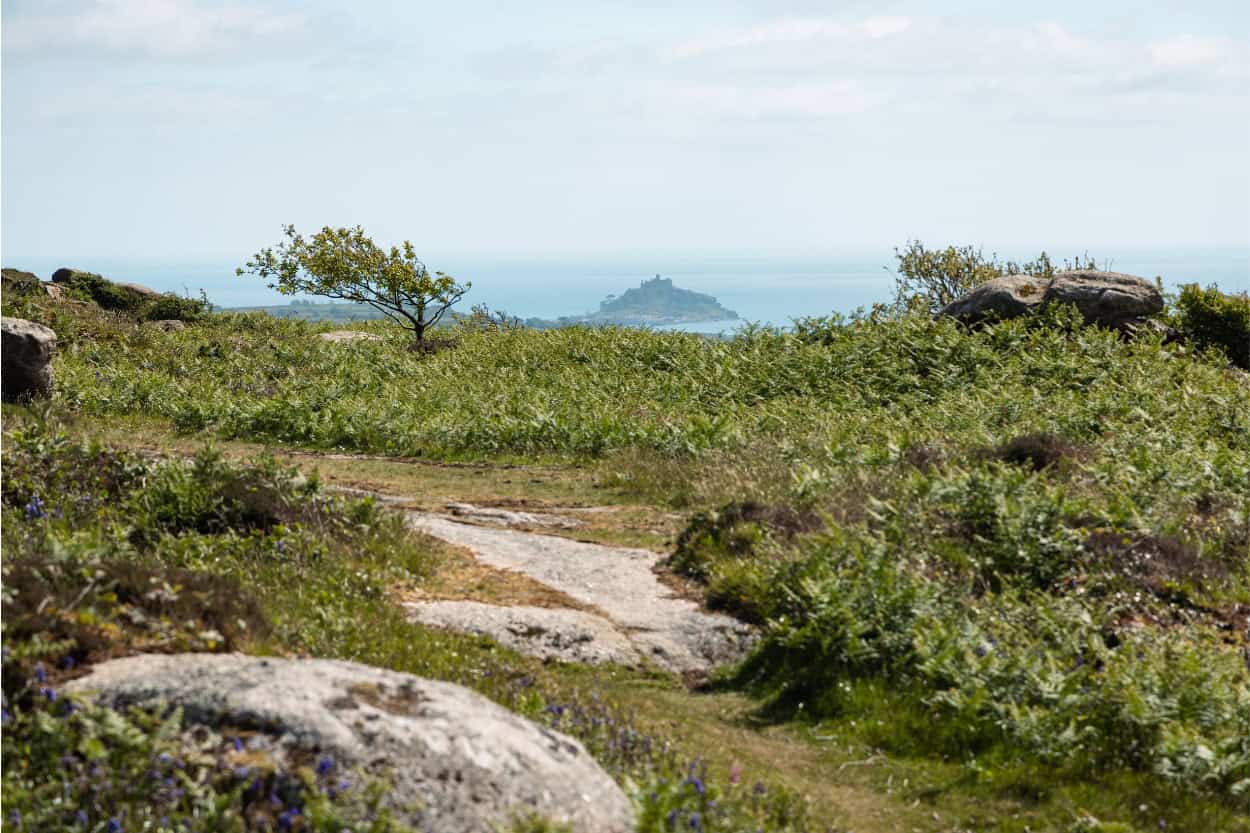 View from a hilltop near St. Ives looking toward St. Michael's Mount in the distance, England. Macs Adventure Review.