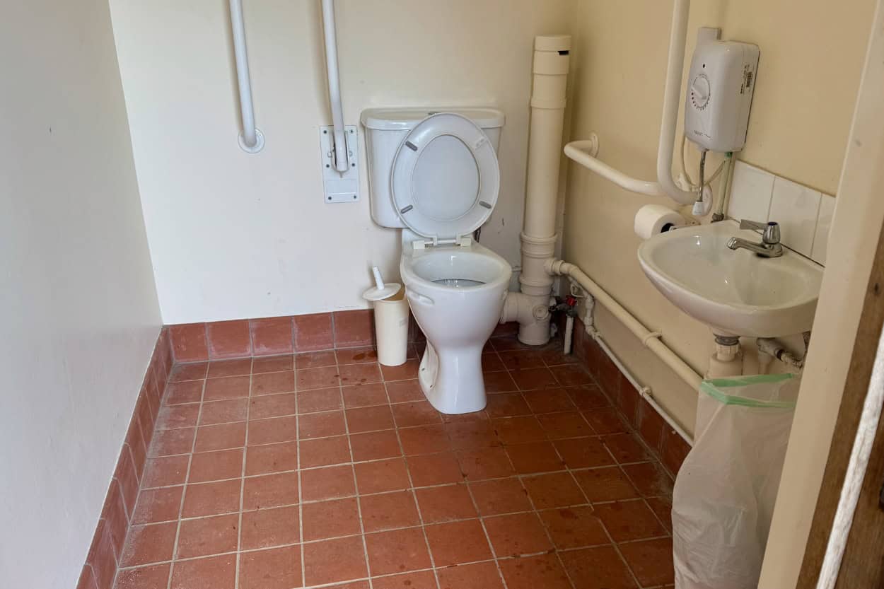 Clean public bathroom inside a church welcoming walkers in the Cotswolds, England. Macs Adventure Review.