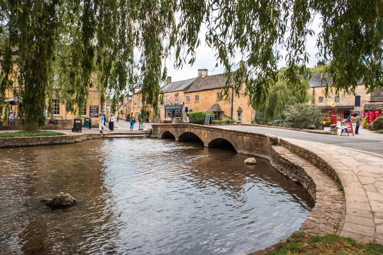 Stone bridge crossing the creek walking the Cotswolds in Bourton-on-the-Water