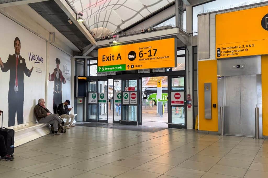 Heathrow Airport bus terminal signs pointing to National Express Oxford