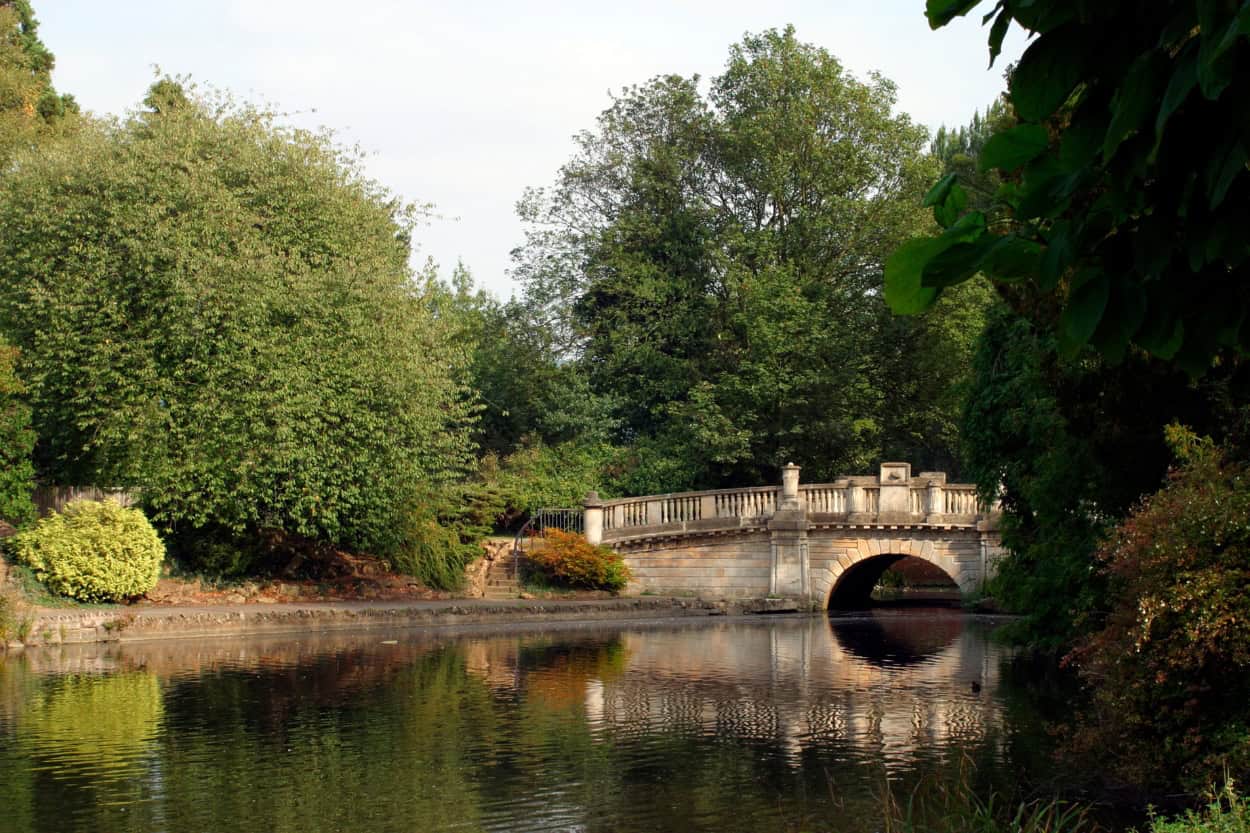 Bridge in a Cheltenham park along the Cotswold Way walking the Cotswolds England