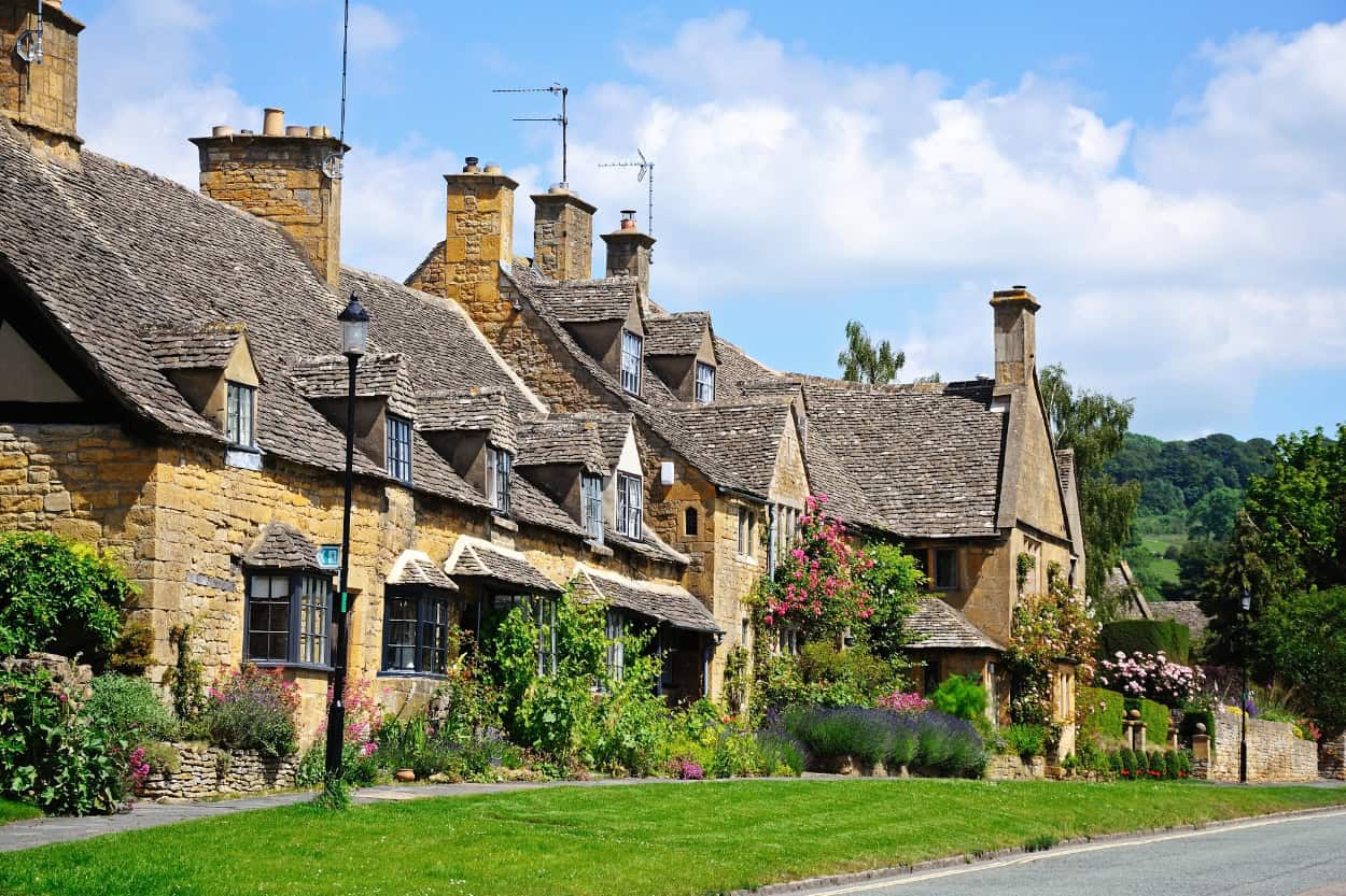 Row of golden stone homes walking the Cotswolds in Broadway