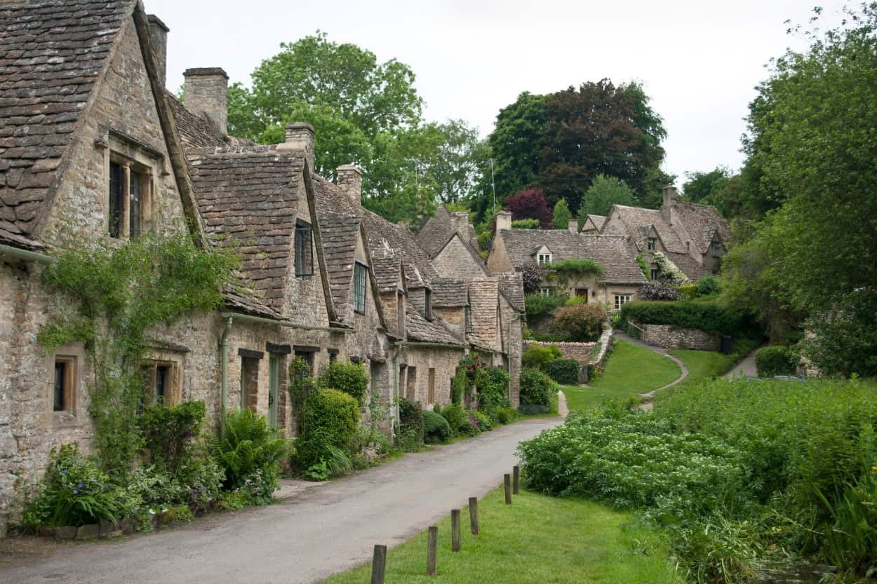 Stone homes in Bibury on a rainy day walking the Cotswolds England