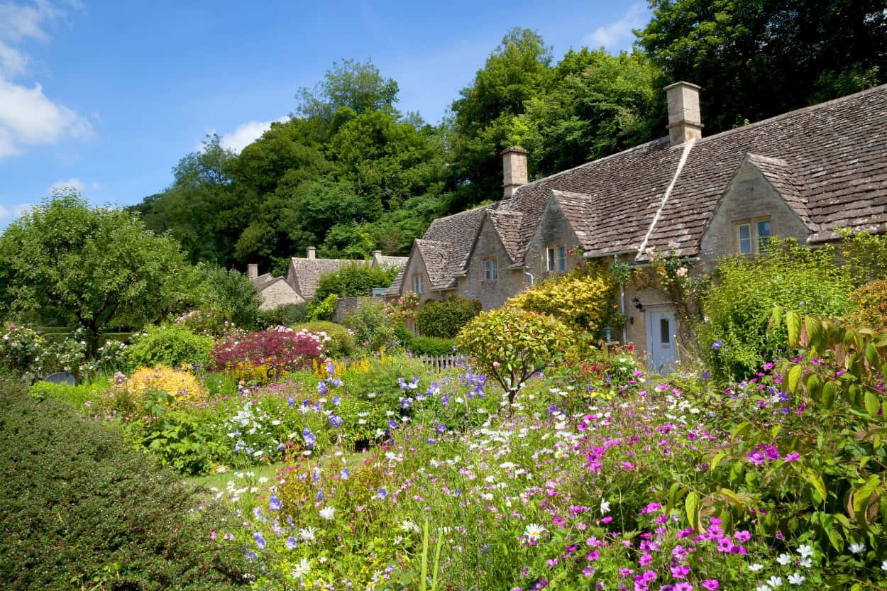 Blooming garden walking the Cotswolds in Bibury England
