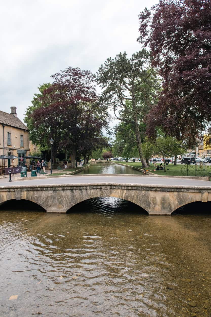Stone pedestrian bridge walking the Cotswolds in Bourton-on-the-Water