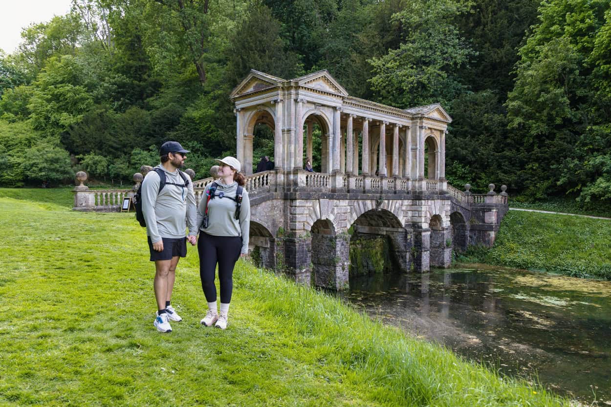 Katie and Joe standing in front of the Palladian Bridge in Bath, England