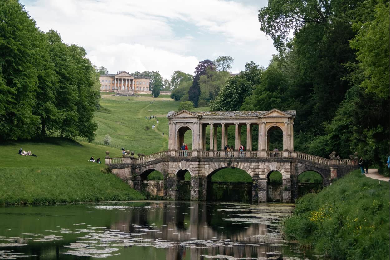 Palladian Bridge at Prior Park with Prior Park College visible on the hill behind it