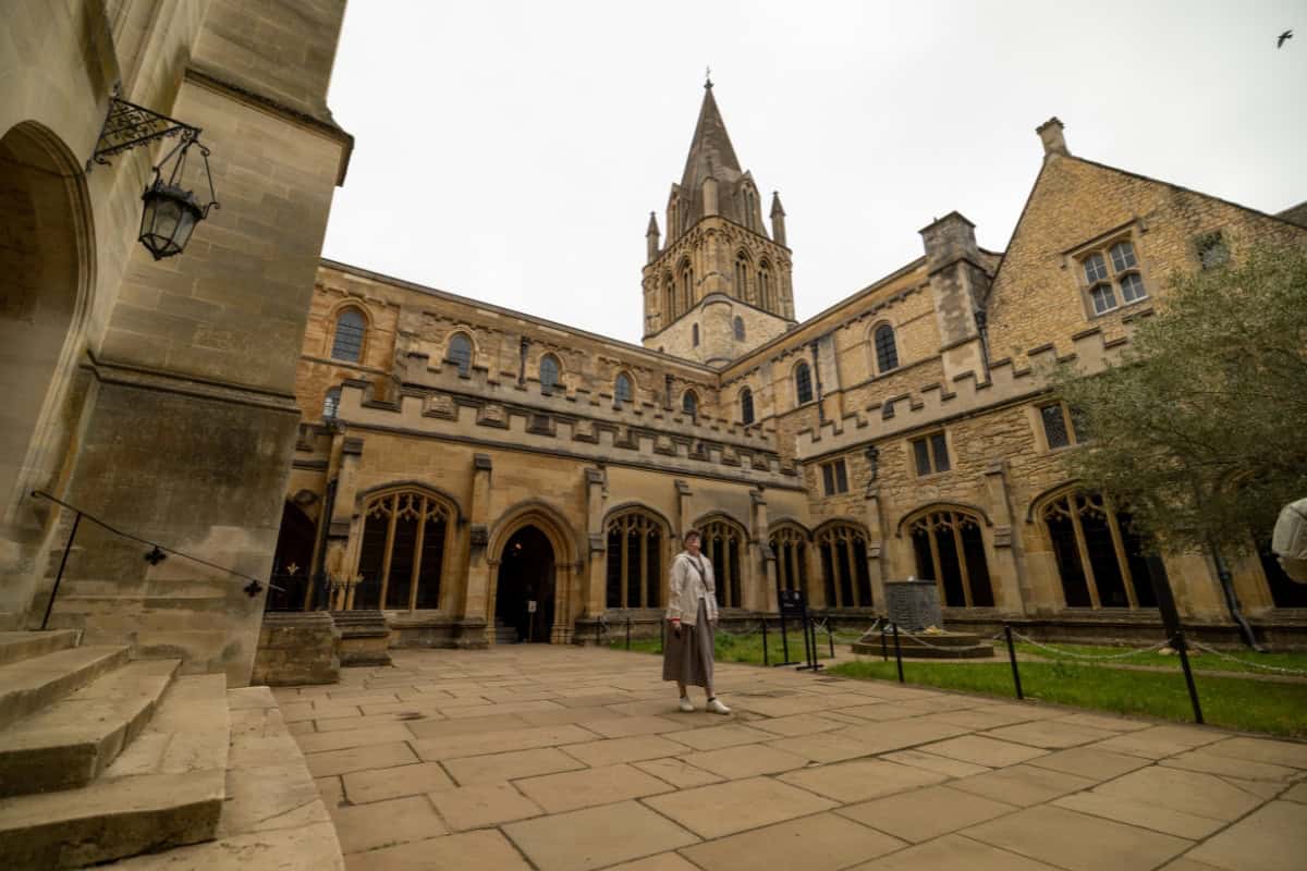 Katie standing in the cloisters courtyard at Christ Church Oxford