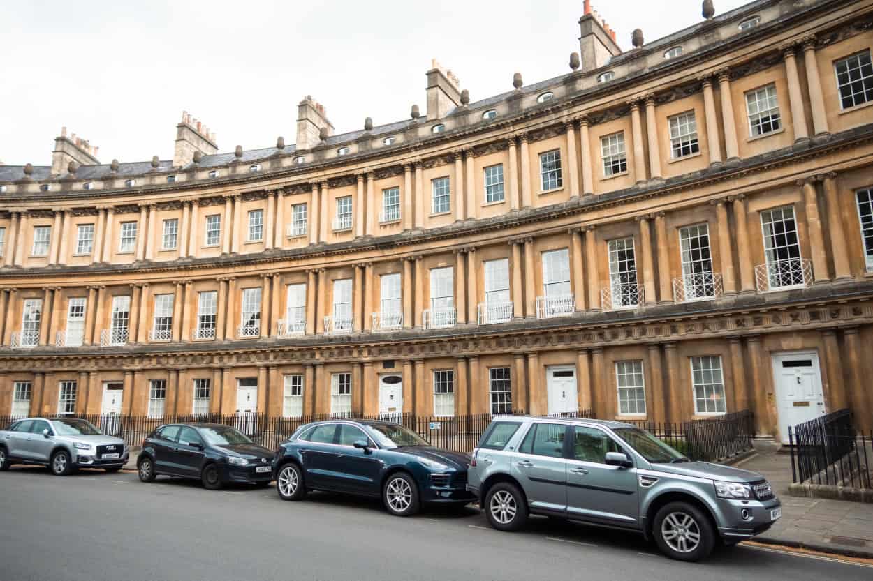 Cars parked in front of The Circus, a ring of Georgian townhouses in Bath, England