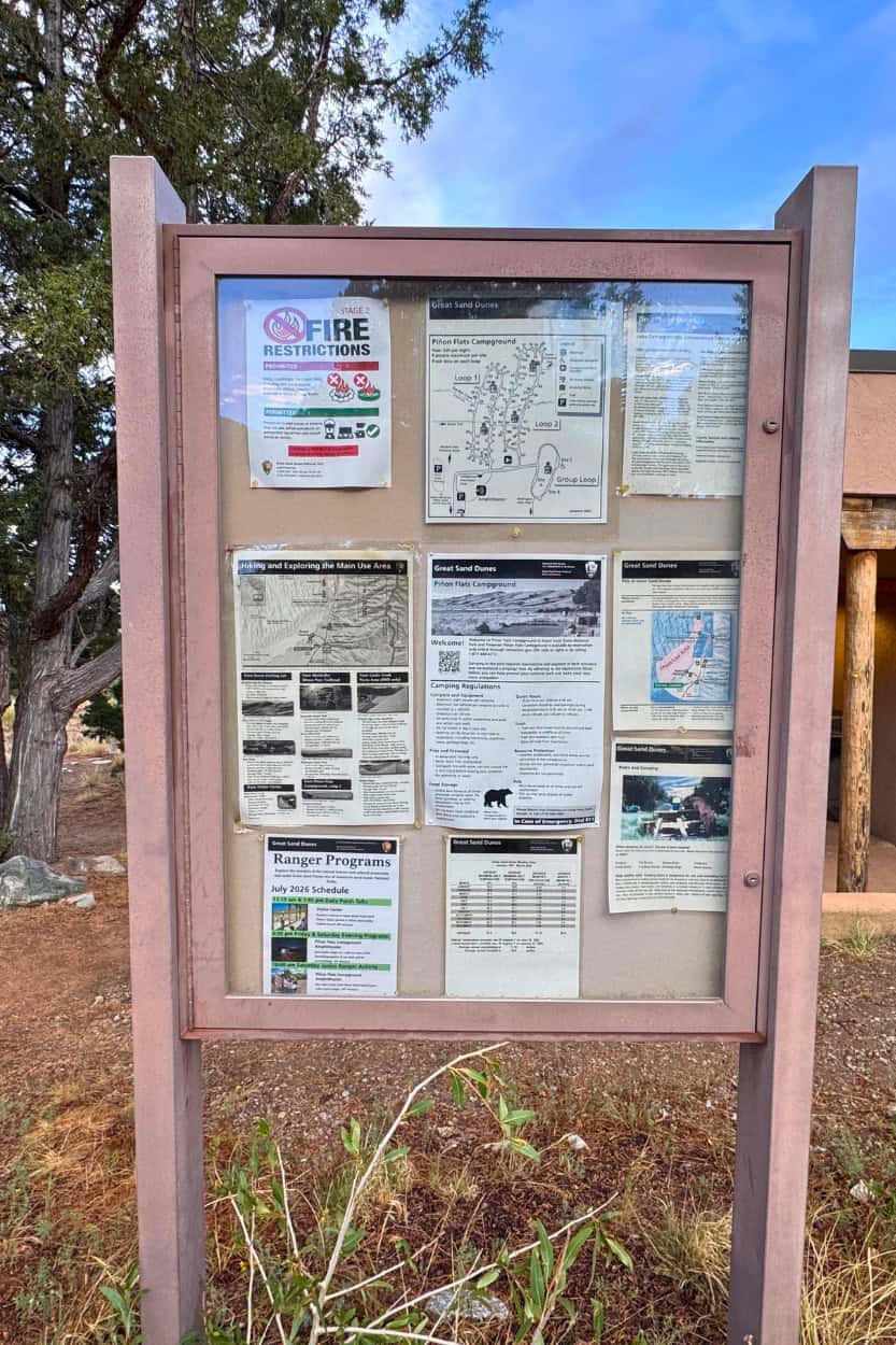 Fire restriction and ranger program posters at Piñon Flats Campground