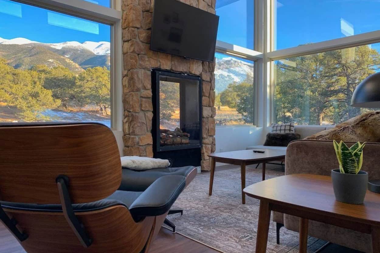 Living room with fireplace at Trails End Getaway near Great Sand Dunes National Park