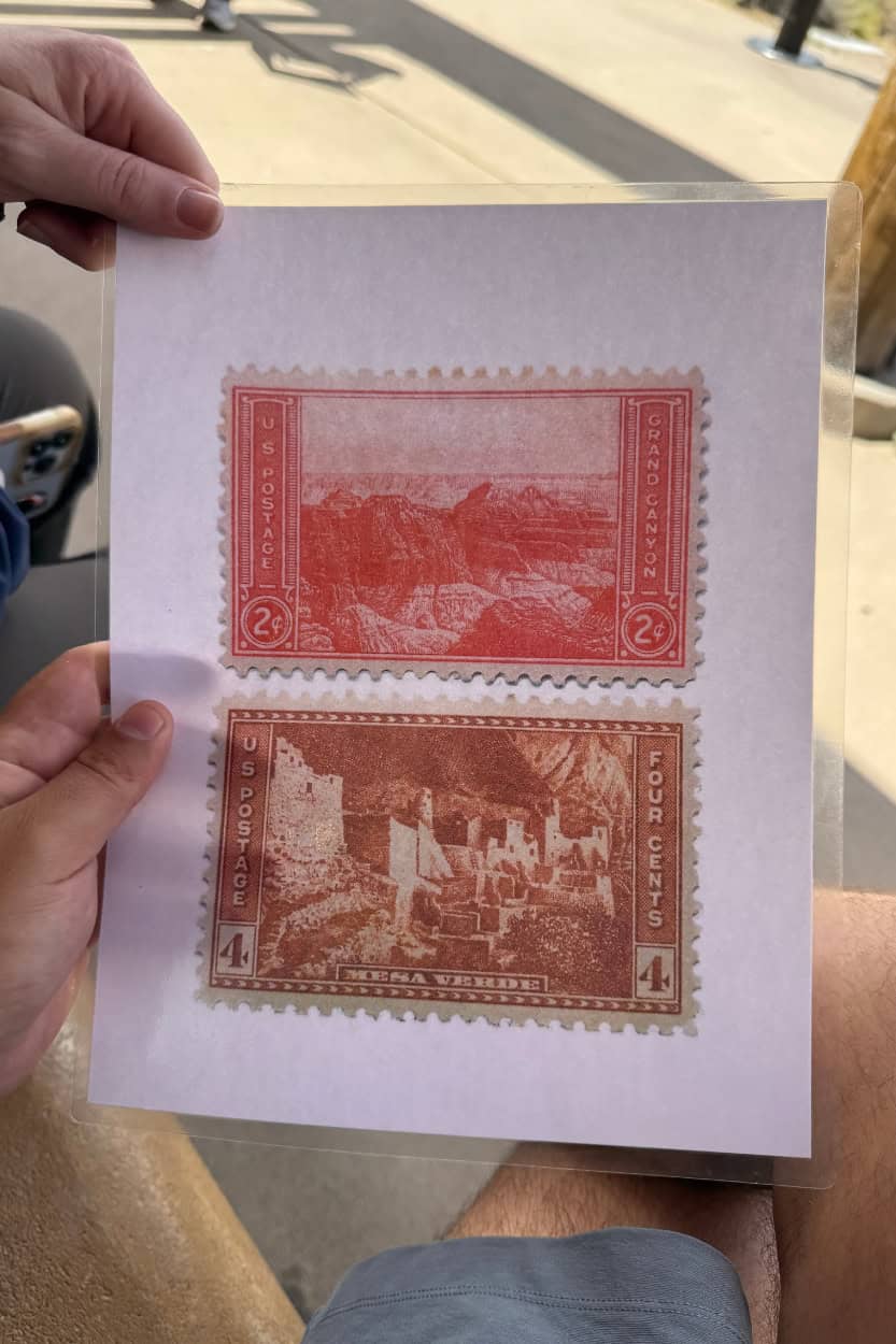 Vintage Mesa Verde and Grand Canyon National Park postage stamps displayed at Great Sand Dunes National Park