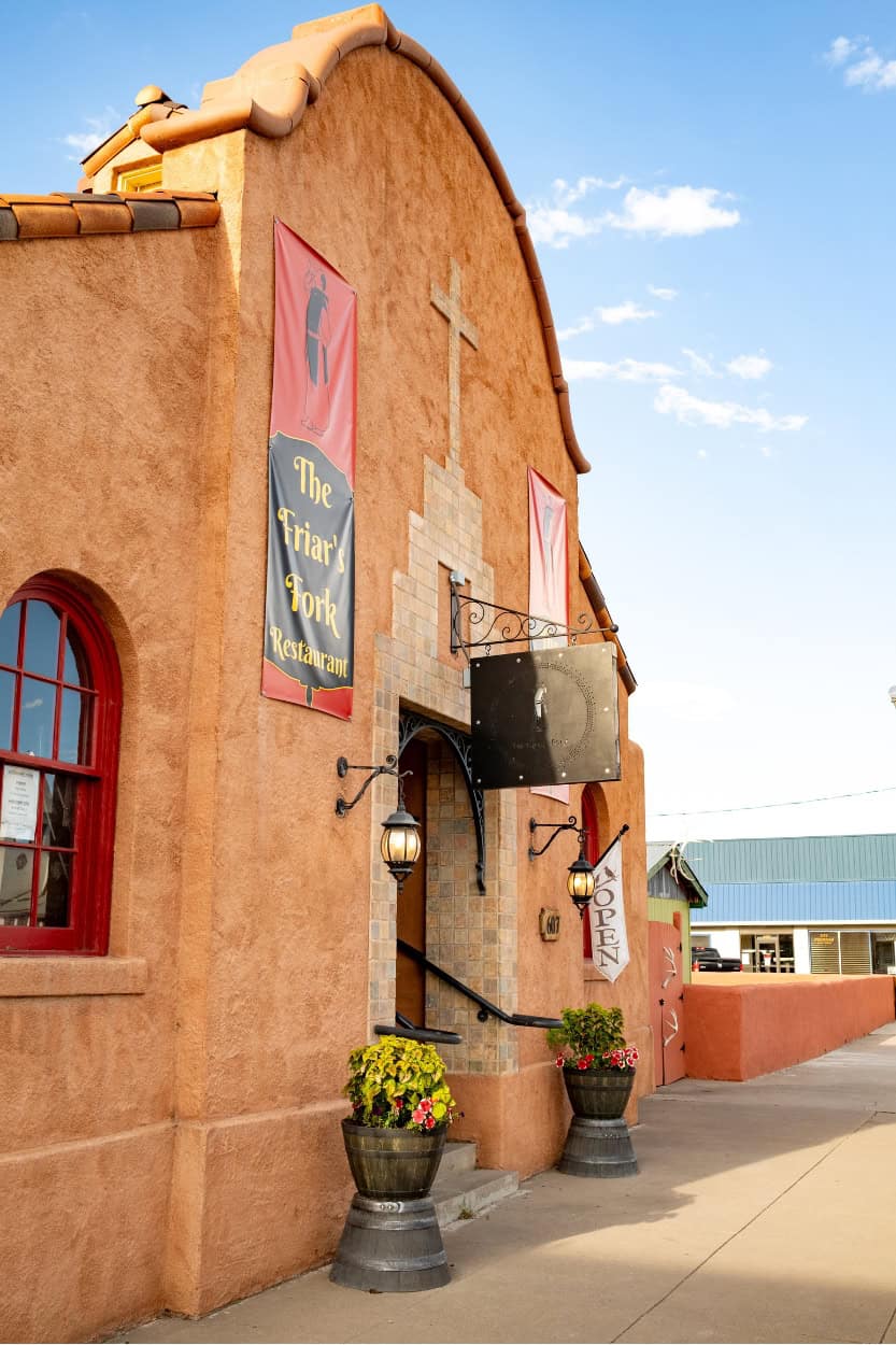 Stucco exterior of Friar's Fork restaurant in Alamosa, Colorado