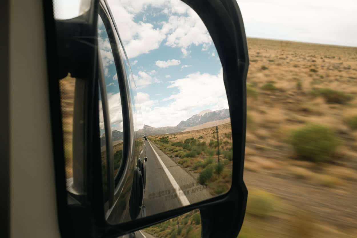 Great Sand Dunes National Park reflected in a van's side mirror in Colorado