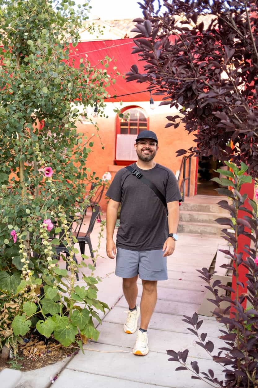 Man walking through the courtyard at The Friar's Fork restaurant in Alamosa, Colorado